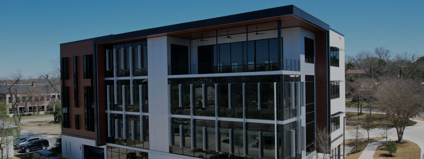 Commercial building with expansive glass windows and architectural metal framing